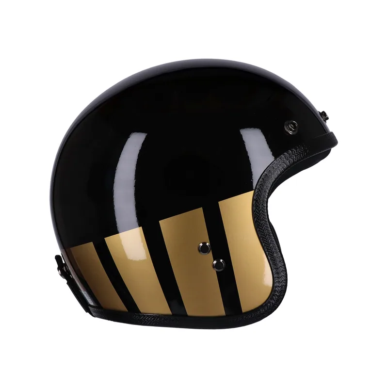 Capacete Roeg Jett Curbstone Gold, preto com faixas douradas, vista lateral.