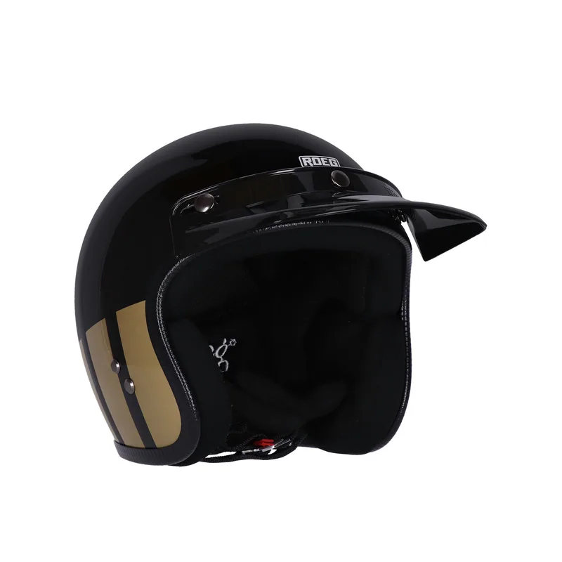 Capacete Roeg Jett Curbstone Gold, preto com faixas douradas, vista de três quartos com pala.